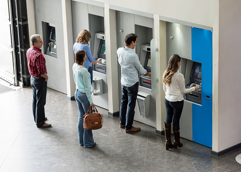 People in line at bank of ATMs