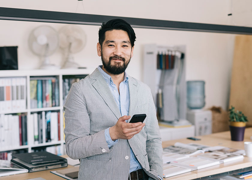 Business owner standing in his office after succession planning